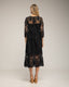 Vestido midi de guipur con transparencias en el escote y las mangas.