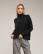 Jersey oversize de punto con cuello perkins y detalles de cuadros