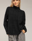 Jersey oversize de punto con cuello perkins y detalles de cuadros