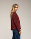 Jersey oversize de punto con cuello perkins y detalles de cuadros