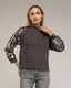 Jersey de punto con mangas de lentejuelas.