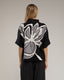 Jersey de punto estampado de flores con lentejuelas y manga francesa.