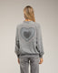 Sudadera efecto desgastado con detallles de strass.