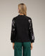 Jersey de punto con mangas de lentejuelas. - Tantra Spain