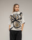 Jersey de punto estampado de flores con lentejuelas y manga francesa. - Tantra Spain