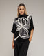 Jersey de punto estampado de flores con lentejuelas y manga francesa. - Tantra Spain