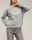 Sudadera con dibujo de estrella con lentejuelas y textura. - Tantra Spain