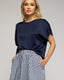 Top de raso oversize con bajo y cuello de punto. - Tantra Spain