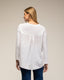Top oversize con cuello pico, de punto en la parte delante y pliegue en la parte de atrás, detalle de volante en el bajo - Tantra Spain
