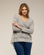 Top oversize con cuello pico, de punto en la parte delante y pliegue en la parte de atrás, detalle de volante en el bajo - Tantra Spain