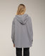 Camisa oversize de vichy con capucha y bolsillo.
