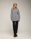 Camisa oversize de vichy con capucha y bolsillo.