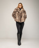 Short faux fur coat in multiple shades, with lapels and side pockets
