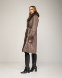 Long faux fur coat with fur trim and short fur lining, side pockets and belt