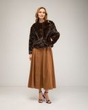 Short reversible jacket in short faux fur with faux suede lining, snap button closure, stand-up collar and pockets
