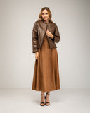Short reversible jacket in short faux fur with faux suede lining, snap button closure, stand-up collar and pockets
