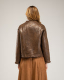 Short reversible jacket in short faux fur with faux suede lining, snap button closure, stand-up collar and pockets