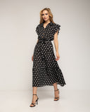 Vestido midi de lunares con botones en la parte de arriba, falda de vuelo y cinturón - Tantra Spain
