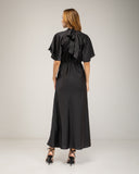 Long satin dress with a turtleneck and bow at the back, fitted at the waist with short flared sleeves