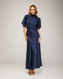Long satin dress with a turtleneck and bow at the back, fitted at the waist with short flared sleeves