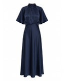 Long satin dress with a turtleneck and bow at the back, fitted at the waist with short flared sleeves
