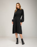 Oversized fine knit dress with a high neck, fitted at the front waist, and elastic cuffs