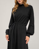 Oversized fine knit dress with a high neck, fitted at the front waist, and elastic cuffs