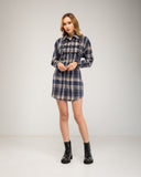 Short checkered shirt dress with lace-up and button details. Drawstrings at the waist