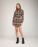 Short checkered shirt dress with lace-up and button details. Drawstrings at the waist