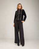 Knitted jacket with gold buttons and hook-and-eye closure