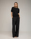Pantalon de vestir corte recto con pinzas, amplio, y  bolsiilos.