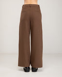 Straight-leg dress pants with a wide hem, side pockets, and faux back pockets