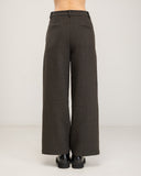 Straight-leg dress pants with a wide hem, side pockets, and faux back pockets