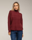 Jersey oversize de punto con cuello perkins y detalles de cuadros