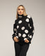 Jersey amplio de lunares con cuello alto