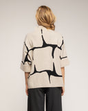 Jersey de punto fino estampado geometrico con manga francesa y detalle de boton - Tantra Spain