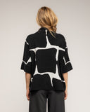 Jersey de punto fino estampado geometrico con manga francesa y detalle de boton - Tantra Spain