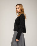 Wool knit sweater with a crew neck and cable-knit pattern