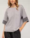 Oversized fine-knit sweater with half sleeves and stripe detail on the sleeve