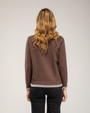 Fine-knit sweater with a crew neck and topstitching at the neck, cuffs, and hem