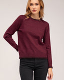 Jersey de punto fino con cuello redondo y pespunte en cuello, puños y bajo