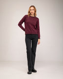 Fine-knit sweater with a crew neck and topstitching at the neck, cuffs, and hem