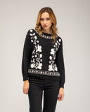 Knitted sweater with a crew neck and embroidered flowers on the chest, neckline and hem