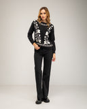 Knitted sweater with a crew neck and embroidered flowers on the chest, neckline and hem