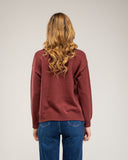 Knitted sweater with a crew neck and embroidered flowers on the chest, neckline and hem