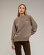 Sudadera efecto desgastado con detallles de strass.