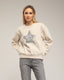 Sudadera con dibujo de estrella con lentejuelas y textura.