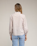 Blusa de cuello alto con volantes y apertura - Tantra Spain