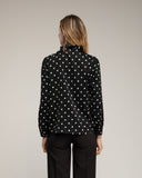 Blusa de lunares con volantes en el pecho. (NEGRA) - Tantra Spain