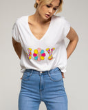 Camiseta con texto "joy" y lentejuelas y abalorios. - Tantra Spain